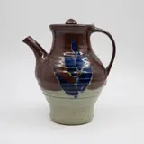 Warren Tippett, Teapot, stoneware decorated with underglaze blue leaf design on an iron glaze band