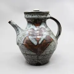 Teapot by Warren Tippett, stoneware with wax resist tenmoku pattern on a mottled grey ground, sold Sep 2026