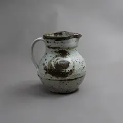 Len Castle, Small jug, stoneware with matt white glaze over saturated iron glaze, with gestural design