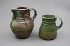 Warren Tippett, Green jug and mug, stoneware, with poured green glaze with red copper highlights (mug AF)