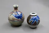 Warren Tippett, Two small vases, stoneware with underglaze blue leaf design