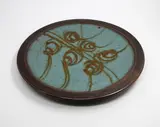 Peter Stichbury, Large round platter, decorated with a gestural iron sand pattern to the ash grey centre framed by a tenmoku border, c. 1990s