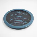 Peter Stichbury, Large round wall platter, with blue wax resist decoration depicting three fish on a black ground