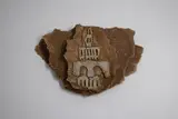 Doris Dutch, Cityscape plaque, ochre washed three-layered stoneware with applied relief decoration (AF)