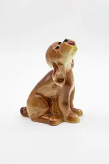 Slip cast dog by Crown Lynn Potteries, in a glossy brown glaze with realistic details, sold Jun 2026