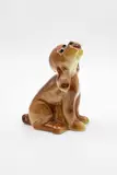 Crown Lynn Potteries, Slip cast dog, in a glossy brown glaze with realistic details