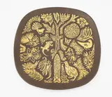 Crown Lynn Potteries, 'Legend' wall plate, rounded square form with gilt highlighted relief decoration of stylised iconic New Zealand flora and fauna imagery (with hanging wire)