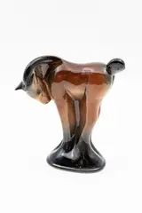 Stylised standing horse by Crown Lynn Potteries, in black and brown glossy glazes, sold Jun 2026