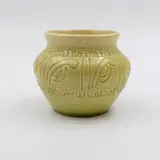 Briar Gardner, Small jar, in yellow glaze with incised koru decoration