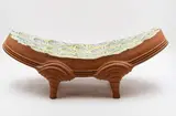 Dixie Tunnicliff and Vincent Forster, Large decorative platter, terracotta with colourful carved glazed abstract design to the top, raised on four feet