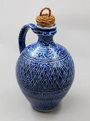Mirek Smisek, Oil bottle, stoneware with blue salt glaze, with original woven cane and cork stopper, ca. 1990's