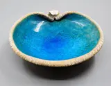 Len Castle, Pacific Series Avian Bowl, the interior with bright alkaline blue glaze, fading to a green tone around the rim, the texture exterior with white and ochre pigment
