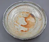 Len Castle, Low profile bowl, shino glazed stoneware, with orange highlights and carbon inclusions, the glaze with crackle effect, ca. 1980's