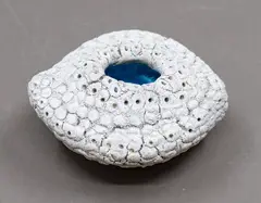 Small Sea Secret by Len Castle, ceramic form with white textured exterior and alkaline blue glazed interior, sold Jun 2026