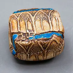 Doris Dutch, Small lidded square box, ochre washed stoneware, decorated with an applied cathedral windows pattern within two lines of thick blue glaze, blue glaze to the interior, ca. 1980's