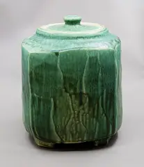Peter Alger, Large squared lidded crock, wood fired stoneware with bright green copper glaze, raised on four feet, with reversible lid, ca. 1990's