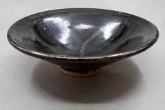 Peter Alger, Conical footed bowl, stoneware with back tenmoku glaze with subtle gestural linear design to the cavetto, early 1980's