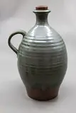 Peter Stichbury, Large flagon, stoneware with grey rutile glaze over tenmoku glaze, with original ceramic and cork stopper