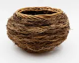 Ruth Castle, Coiled basket, woven rattan interlaced with twigs and fibres