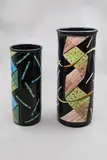 Two tall cylinder vases by Warren Tippett, with polychrome abstract decoration (one restored), sold Jun 2026