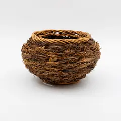 Ruth Castle, Coiled basket, woven rattan interlaced with twigs and fibres