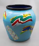 Polychrome jardiniere by Warren Tippett, decorated with brightly coloured abstract panels on a blue ground, sold Jun 2026
