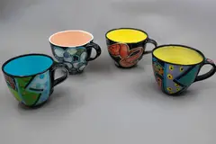 Four mugs by Warren Tippett, with various polychrome decorations (AF), sold Jun 2026