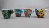Four mugs by Warren Tippett, with various polychrome decorations (AF), sold Jun 2026