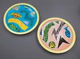 Warren Tippett, Two circular plates, with polychrome abstract and fish decoration on blue and pink grounds