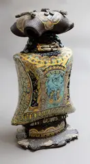 Claire Roger, Lidded bottle, sculptured ceramic with hand-cut intricate design through stratified pigmented coloured clays