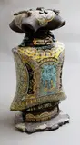 Claire Roger, Lidded bottle, sculptured ceramic with hand-cut intricate design through stratified pigmented coloured clays