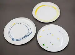 Amanda Shanley, Three shaped plates, hand thrown white earthenware, with colourful abstract decoration to the centre, the unglazed reverse with scribble design