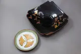 Studio Pottery, Two decorative dishes, including a large tenmoku and gold leaf table bowl, and a small dish with clover design