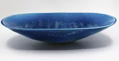 Len Castle, Large deep well platter, white earthenware with alkaline blue glaze, impressed rope pattern to the centre