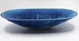 Len Castle, Large deep well platter, white earthenware with alkaline blue glaze, impressed rope pattern to the centre