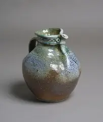 Barry Brickell, Fatso jug, rich blue, green and brown salt glazed stoneware with typical pinched rim with stylized characterful beak form spout