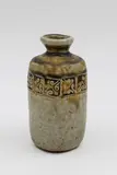 Chester Nealie, Small bottle vase, glazed stoneware with impressed geometrical design