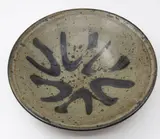 Barry Brickell, Wide stoneware bowl, with grey ash glaze and saturated iron underglaze, a blue brushed abstract pattern to the centre