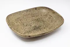 Len Castle, Large rectangular platter, stoneware with oatmeal glaze over saturated iron glaze, with stamp decoration to the well and centre