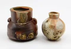 Two small bottles by Chester Nealie, wood fired stoneware, sold Feb 2026