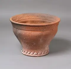 Large garden planter by Barry Brickell, unglazed terracotta with lobed and fluted walls and impressed decorative patterns to the rims, natural patina, sold Feb 2026