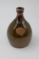 Barry Brickell, 'SYC Thames Wines' bottle, stoneware with tenmoku and ash glazes, impressed brand mark to shoulders