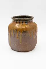 Trickle glaze vase by Barry Brickell, unglazed stoneware with pigment wash, trickle ochre glaze to the shoulders, sold Feb 2026
