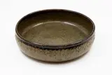 Barry Brickell, Large fruit bowl, stoneware with oatmeal glaze over saturated iron glaze, impressed decorative pattern to outer rim
