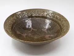 Barry Brickell, Table bowl, stoneware with ash glaze and tenmoku wax resist design to the centre, impressed decorative pattern to the rim