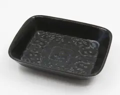 Ngakura Ware dish by Crown Lynn Potteries, with tiki design to the centre; designed by Crown Lynn for the tourist market and manufactured by Luke Adams in Christch, sold Feb 2026