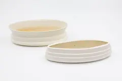 Two ribbed trough vases by Crown Lynn Potteries, white slip-cast ceramic, offered Feb 2026