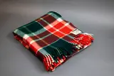 Kaiapoi Petone Group Textiles Ltd, Huia travel Rug, with a tartan design in green, red and white