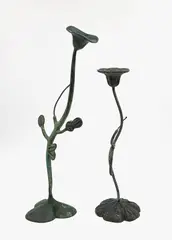 Two single candlesticks by Matthew von Sturmer, bronze, sold Feb 2026