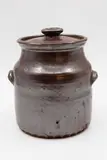 Barry Brickell, Lidded crock, persimmon glazed stoneware of barrel form with cup handles